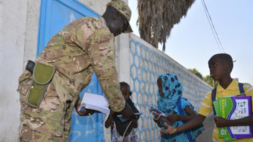 Air Force Staff Sergeant gives school supplies to children in Djibouti