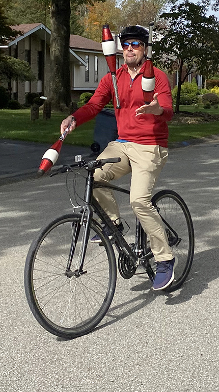 Ross Eaton Juggling while riding a bike