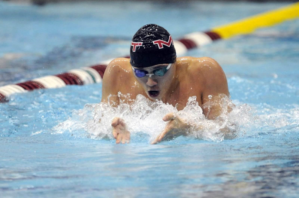 Ben Bauchwitz swimming the breaststroke during the Wheaton Invitational with MIT.